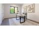 Home office with desk, chair, and large window at 1254 Cordova Ne Blvd, St Petersburg, FL 33704