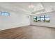 Large main bedroom with hardwood floors and a stunning view from the window at 1254 Cordova Ne Blvd, St Petersburg, FL 33704
