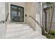 Modern front entrance with stone steps and double doors at 1254 Cordova Ne Blvd, St Petersburg, FL 33704