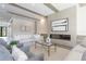 Spacious living room with a modern fireplace and ample seating at 1254 Cordova Ne Blvd, St Petersburg, FL 33704
