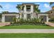 Two-story home with modern architecture and lush landscaping at 1254 Cordova Ne Blvd, St Petersburg, FL 33704