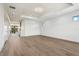 Spacious main bedroom with hardwood floors and views from multiple windows at 1254 Cordova Ne Blvd, St Petersburg, FL 33704