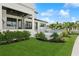 Landscaped backyard with lush greenery and access to a pool and patio at 1254 Cordova Ne Blvd, St Petersburg, FL 33704