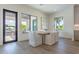Casual dining area with wooden table and access to a balcony at 1254 Cordova Ne Blvd, St Petersburg, FL 33704