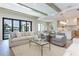 Bright living room features a comfy sofa, accent chairs, and large windows at 1254 Cordova Ne Blvd, St Petersburg, FL 33704