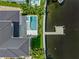 Drone view of waterfront home with private pool and dock at 1254 Cordova Ne Blvd, St Petersburg, FL 33704
