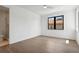 Spacious bedroom with hardwood floors and large window offering natural light at 1254 Cordova Ne Blvd, St Petersburg, FL 33704