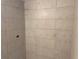Shower with large, light-gray wall tiles at 255 Dolphin Pt # 809, Clearwater, FL 33767