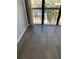 Living area showcasing new flooring and a view from sliding glass doors at 255 Dolphin Pt # 809, Clearwater, FL 33767