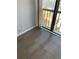 Living room with new vinyl plank flooring and access to balcony with water views at 255 Dolphin Pt # 809, Clearwater, FL 33767