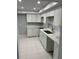 Newly renovated kitchen with white cabinets and quartz countertops at 255 Dolphin Pt # 809, Clearwater, FL 33767
