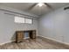 Bedroom with wood-look floors, ceiling fan, and desk at 9490 Harbor Greens Way # 205, Seminole, FL 33776