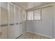 White louvered pantry doors and adjacent window with blinds at 9490 Harbor Greens Way # 205, Seminole, FL 33776