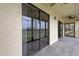 Private screened balcony with view of water at 9490 Harbor Greens Way # 205, Seminole, FL 33776