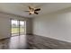 Spacious bedroom with sliding glass doors leading to balcony and laminate flooring at 9490 Harbor Greens Way # 205, Seminole, FL 33776