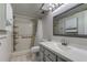Bathroom with shower, toilet, vanity, and storage at 9490 Harbor Greens Way # 205, Seminole, FL 33776