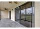 Private screened balcony with tile flooring and sliding glass doors at 9490 Harbor Greens Way # 205, Seminole, FL 33776