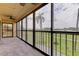 Relaxing screened balcony with scenic view at 9490 Harbor Greens Way # 205, Seminole, FL 33776