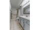 Updated bathroom with walk-in shower, grab bars, and vanity at 9490 Harbor Greens Way # 205, Seminole, FL 33776