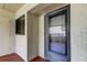Condo entrance with updated door and security screen at 9490 Harbor Greens Way # 205, Seminole, FL 33776
