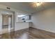 Open living area with wood-look floors and kitchen at 9490 Harbor Greens Way # 205, Seminole, FL 33776