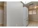 White refrigerator in kitchen with adjacent wall and tile floor at 9490 Harbor Greens Way # 205, Seminole, FL 33776