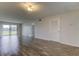 Spacious living room featuring wood-look floors at 9490 Harbor Greens Way # 205, Seminole, FL 33776