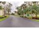 Community entrance with landscaping and signage at 9490 Harbor Greens Way # 205, Seminole, FL 33776