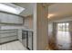 Updated kitchen with gray cabinets and granite counters at 9490 Harbor Greens Way # 205, Seminole, FL 33776