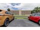 Building exterior with parking and landscaping at 9490 Harbor Greens Way # 205, Seminole, FL 33776