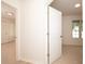 Neutral bedroom with light carpet and white doors leading to other rooms at 379 Fan Palm Ne Ct # 0, St Petersburg, FL 33703