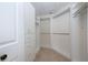 Walk-in closet includes custom shelves and storage at 379 Fan Palm Ne Ct # 0, St Petersburg, FL 33703