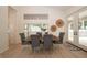 Bright dining room area with neutral walls, modern decor, and stylish wicker wall art at 379 Fan Palm Ne Ct # 0, St Petersburg, FL 33703