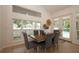 Dining room with large windows and doors that provide plenty of natural light and backyard views at 379 Fan Palm Ne Ct # 0, St Petersburg, FL 33703