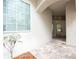 Inviting entrance with tiled floor and white walls, complemented by a large window and arched entryway at 379 Fan Palm Ne Ct # 0, St Petersburg, FL 33703