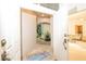Charming entrance featuring an arched entryway, tiled floor, and view into the living room at 379 Fan Palm Ne Ct # 0, St Petersburg, FL 33703