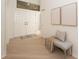 Bright foyer features double doors, neutral decor, and a bench seat with throw pillow at 379 Fan Palm Ne Ct # 0, St Petersburg, FL 33703
