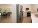 Kitchen with stainless steel appliances, an island with quartz countertop, and an open concept to the dining area at 379 Fan Palm Ne Ct # 0, St Petersburg, FL 33703