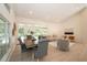 Open concept living and dining area with seamless access to a refreshing pool at 379 Fan Palm Ne Ct # 0, St Petersburg, FL 33703