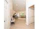 Open-concept living room featuring a high ceiling, light wood floors, and ample natural light at 379 Fan Palm Ne Ct # 0, St Petersburg, FL 33703