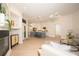 Open living area showcasing a modern kitchen with an island and a comfortable living space with fireplace at 379 Fan Palm Ne Ct # 0, St Petersburg, FL 33703
