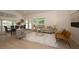 Spacious living room with dining area and French doors showcasing a seamless indoor-outdoor transition at 379 Fan Palm Ne Ct # 0, St Petersburg, FL 33703
