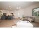 Bright and airy living space featuring an open layout connecting the kitchen, dining, and living areas at 379 Fan Palm Ne Ct # 0, St Petersburg, FL 33703