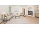 Comfortable living room with a fireplace, neutral decor, and hardwood floors, offering a serene space at 379 Fan Palm Ne Ct # 0, St Petersburg, FL 33703