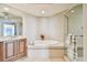 Spa-like bathroom with large soaking tub and shower at 5823 Bowen Daniel Dr # 905, Tampa, FL 33616