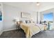 Main bedroom with water view and cozy seating at 5823 Bowen Daniel Dr # 905, Tampa, FL 33616