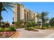Castillo building, beautiful landscaping, and a grand entrance at 5823 Bowen Daniel Dr # 905, Tampa, FL 33616
