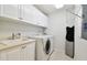 Convenient laundry room with washer and dryer at 5823 Bowen Daniel Dr # 905, Tampa, FL 33616