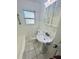 Updated bathroom with a pedestal sink and tub at 2811 Valencia S Way, St Petersburg, FL 33705