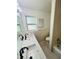 Updated bathroom with double vanity and modern fixtures at 2811 Valencia S Way, St Petersburg, FL 33705